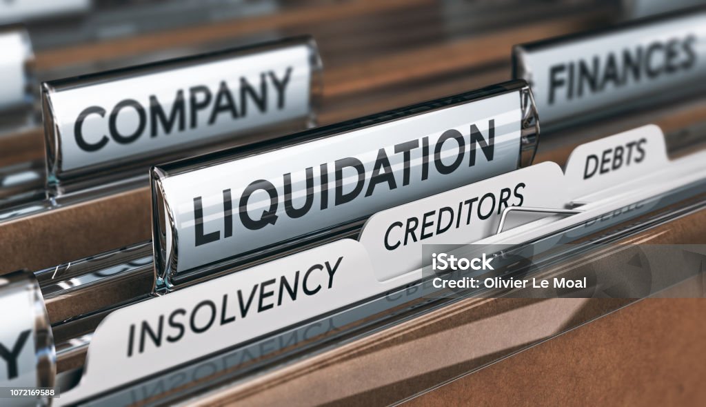 Files and tabs with words Company, Liquidation, Insolvency, Creditors and Debts
